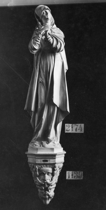 Cul-de-lampe avec tête humaine et feuillage
