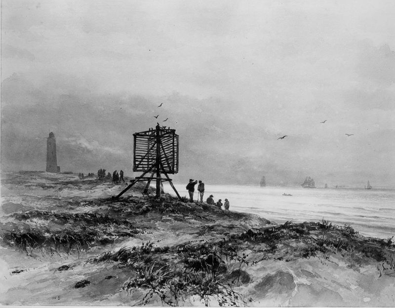 Een vuurbaken en -toren in de duinen