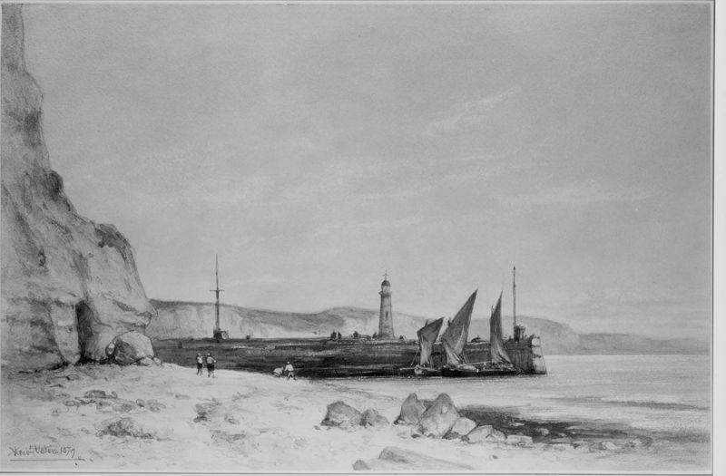 Strand met steiger en vuurtoren