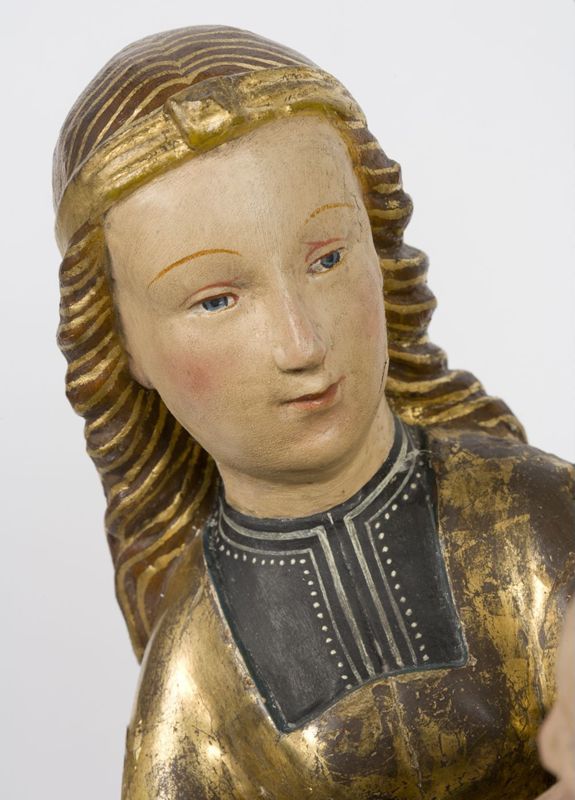 Sainte Anne, la Vierge et l'Enfant conservés dans un retable  peint
