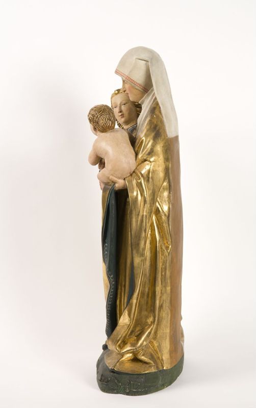 Sainte Anne, la Vierge et l'Enfant conservés dans un retable  peint